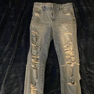 Extremely ripped (how I bought them) A&E skinny jeans, size 10 long, light blue